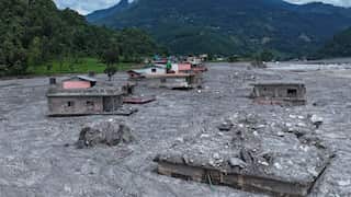 Buildings coated in mud and debris.