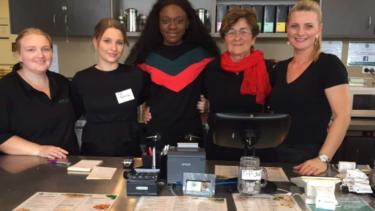 Pemba (centre) and her former colleagues at the Harmony on Carmody Café (Amy Chien-Yu Wang)