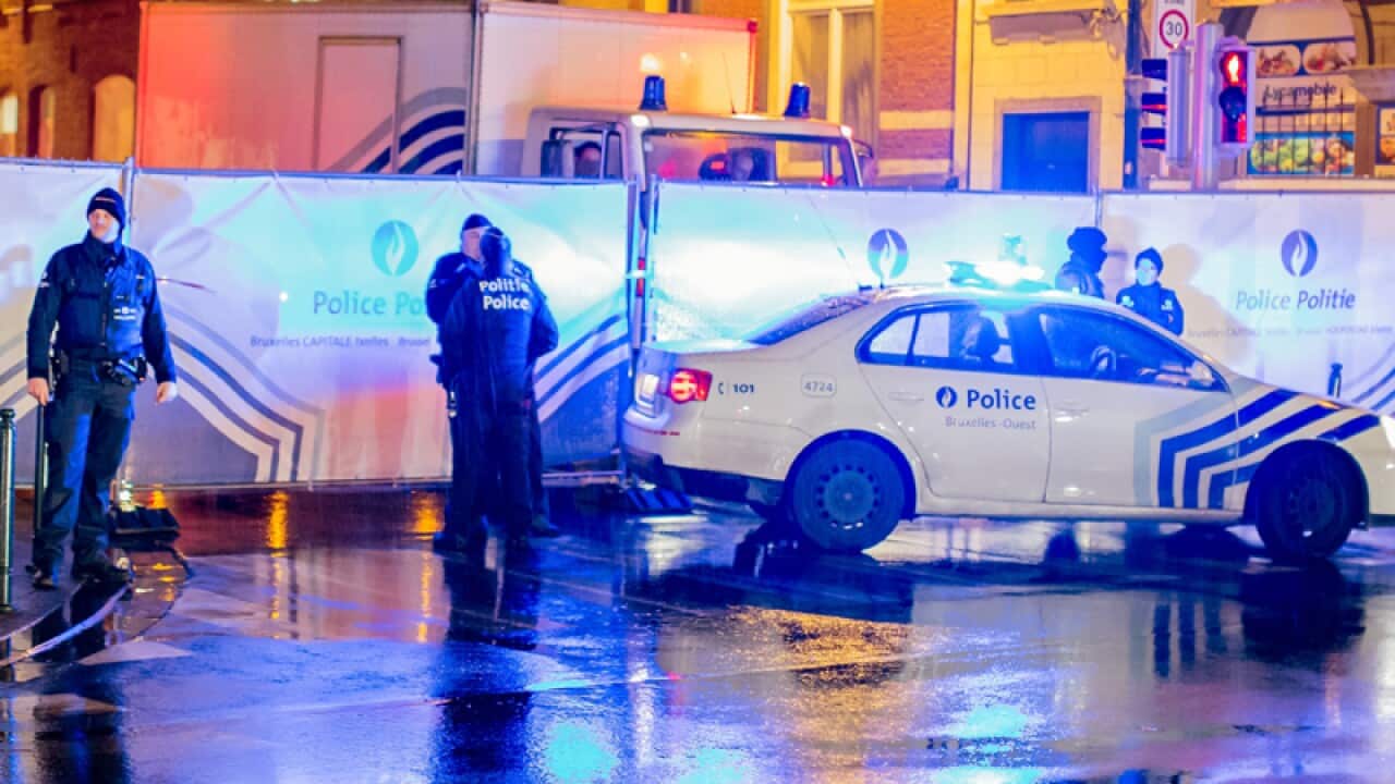 Belgian police guard a street in Brussels