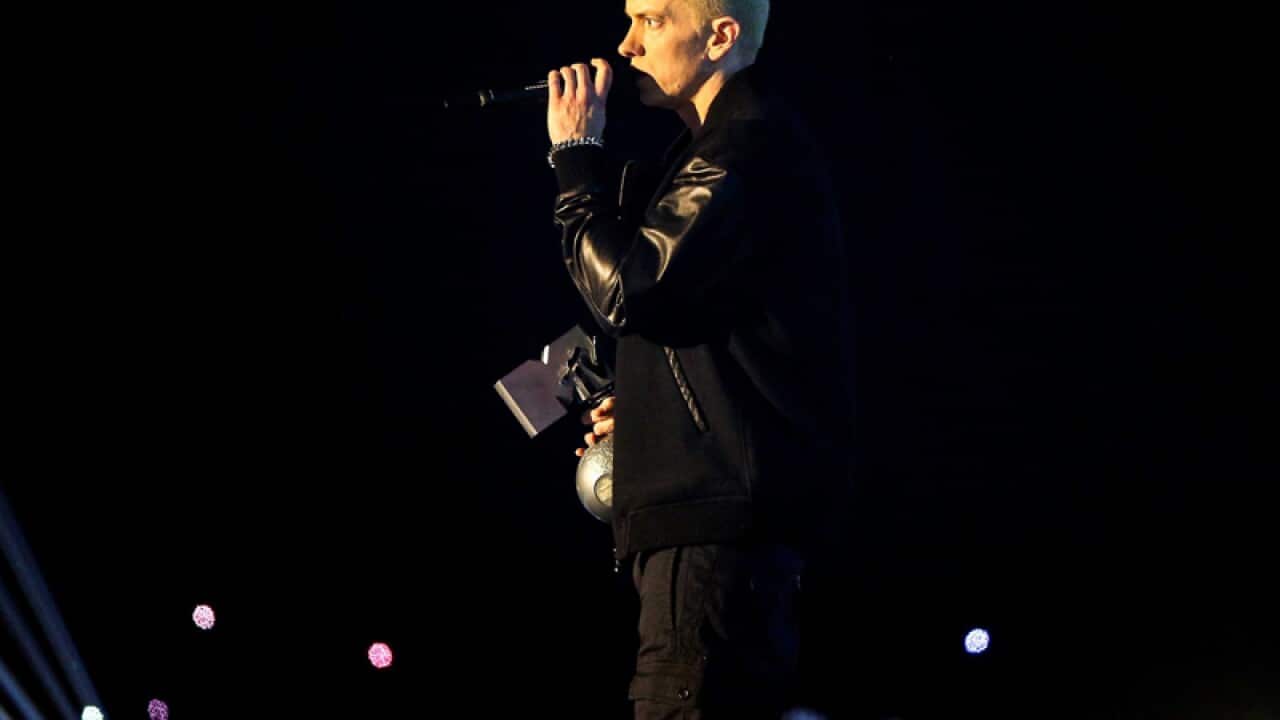 US rapper Eminem speaks onstage at the MTV awards.