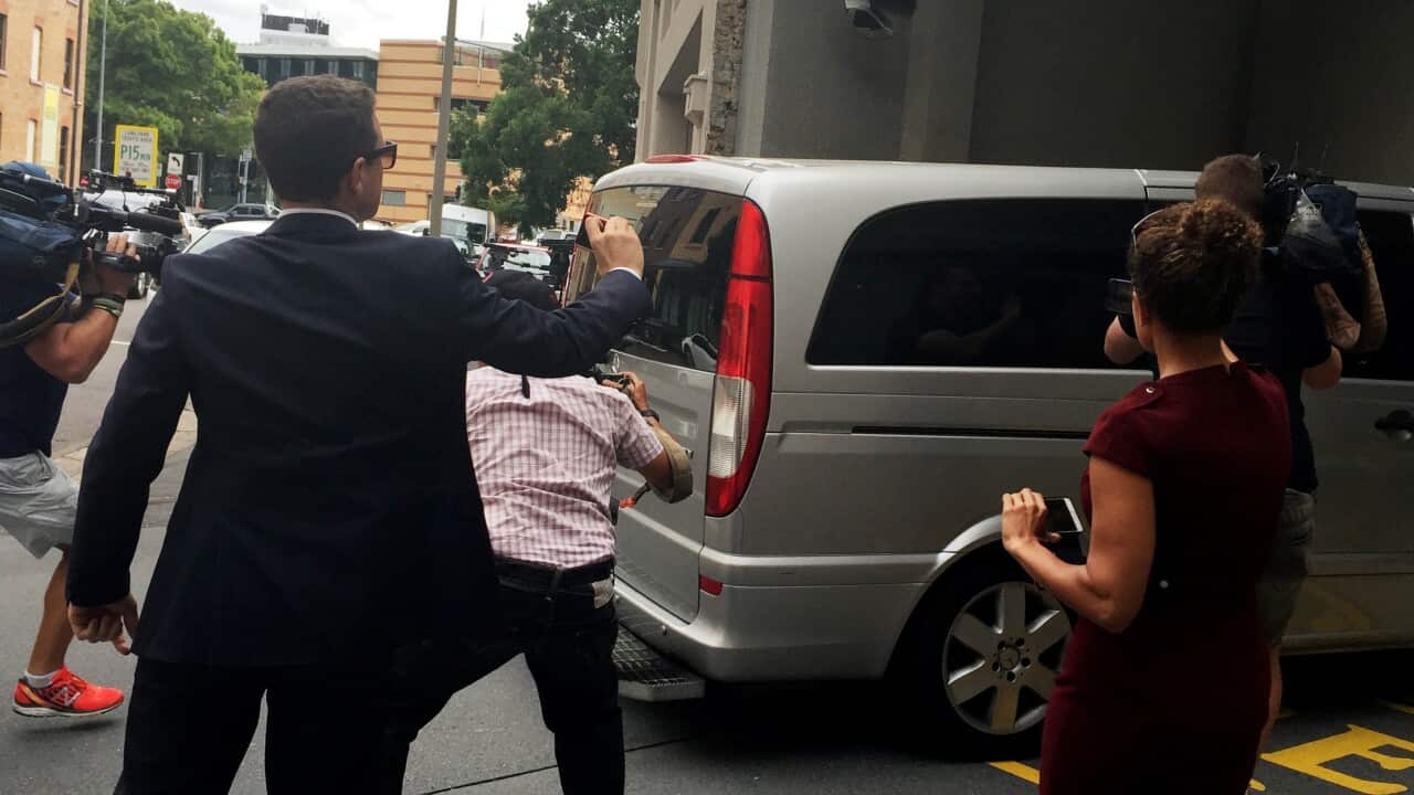 A Queensland correctional van believed to hold Brenden Abbott arrives at the Brisbane Watch House for his extradition hearing.