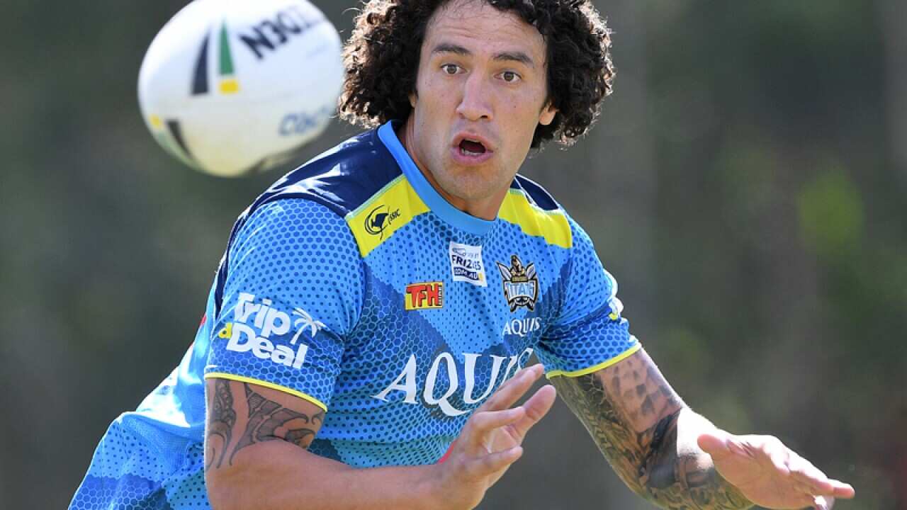 Kevin Proctor receives the ball during the Gold Coast Titans training