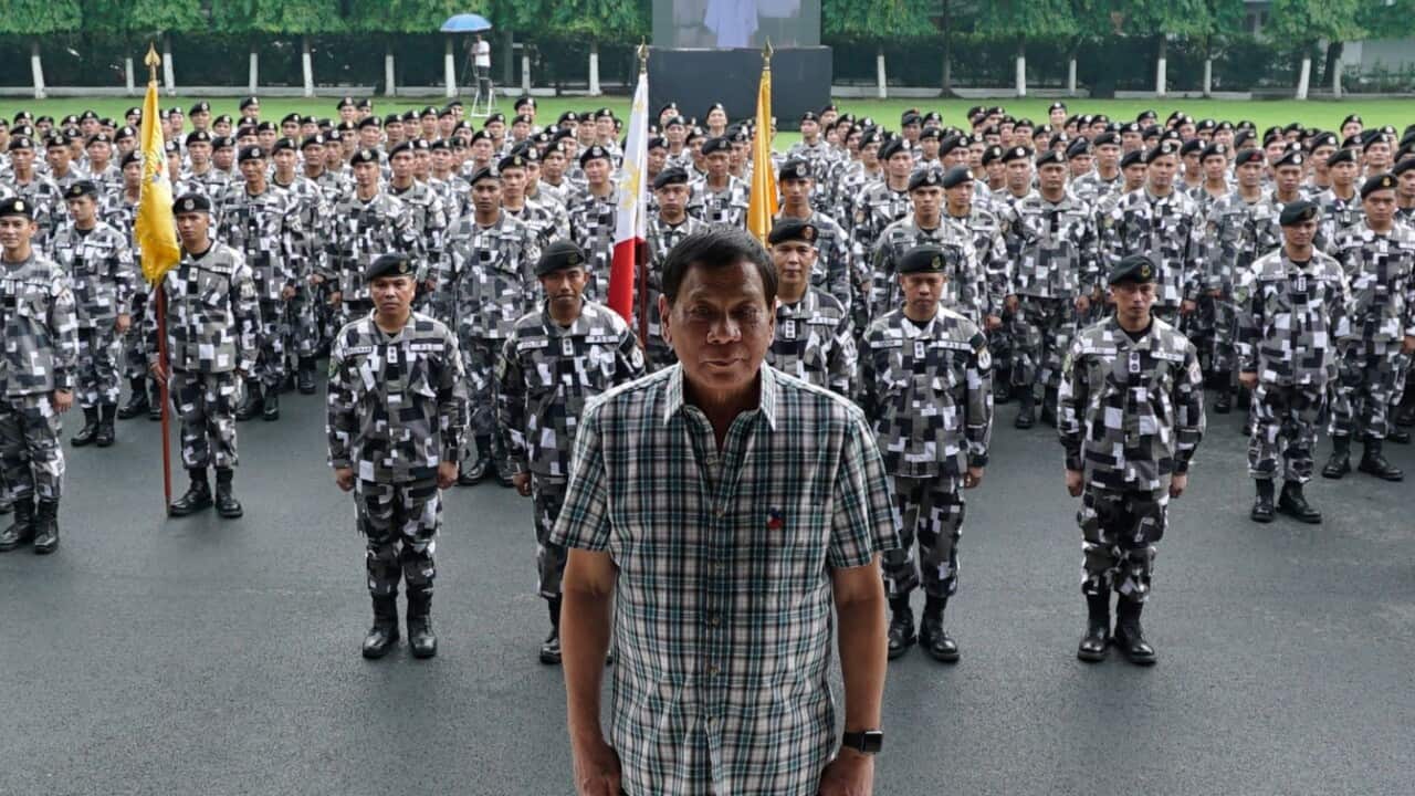 A handout photo made available by the Presidential Photographers Division (PPD) on 28 June 2017 shows Philippine President Rodrigo Duterte (C)