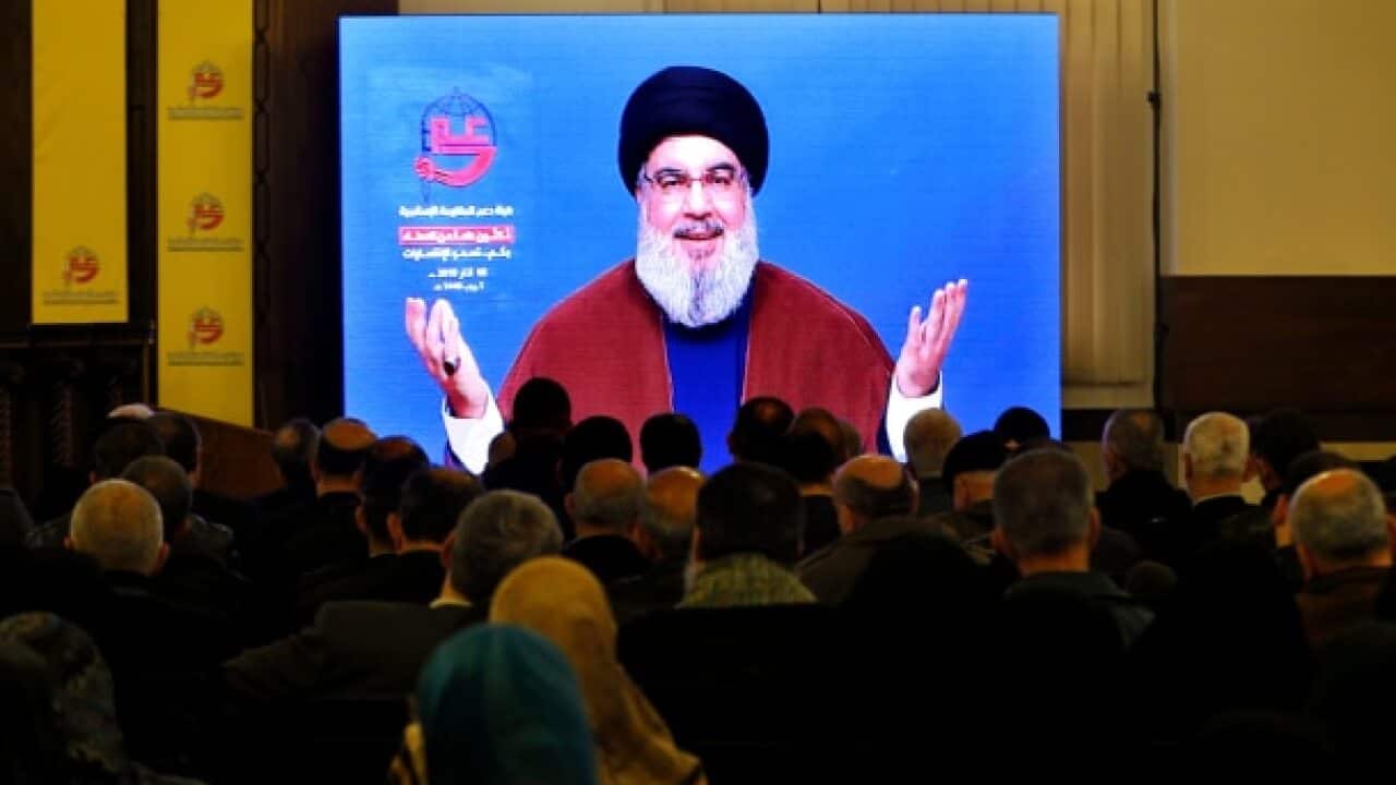 Supporters of the Iranian-backed Hezbollah group listen to a speech of Hezbollah leader Sayyed Hassan Nasrallah