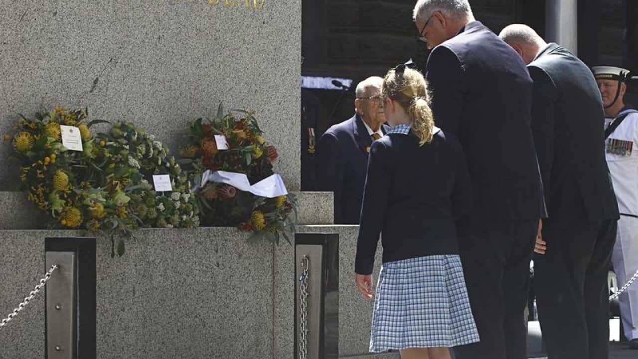 Federal Treasurer Scott Morrison and his Daughter Lily lay a wreath