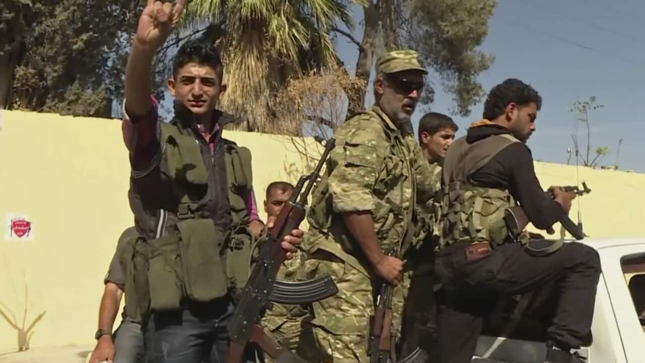 Members of a Turkish-backed Syrian opposition force patrol in Dabiq, Syria, Sunday, Oct. 16, 2016.