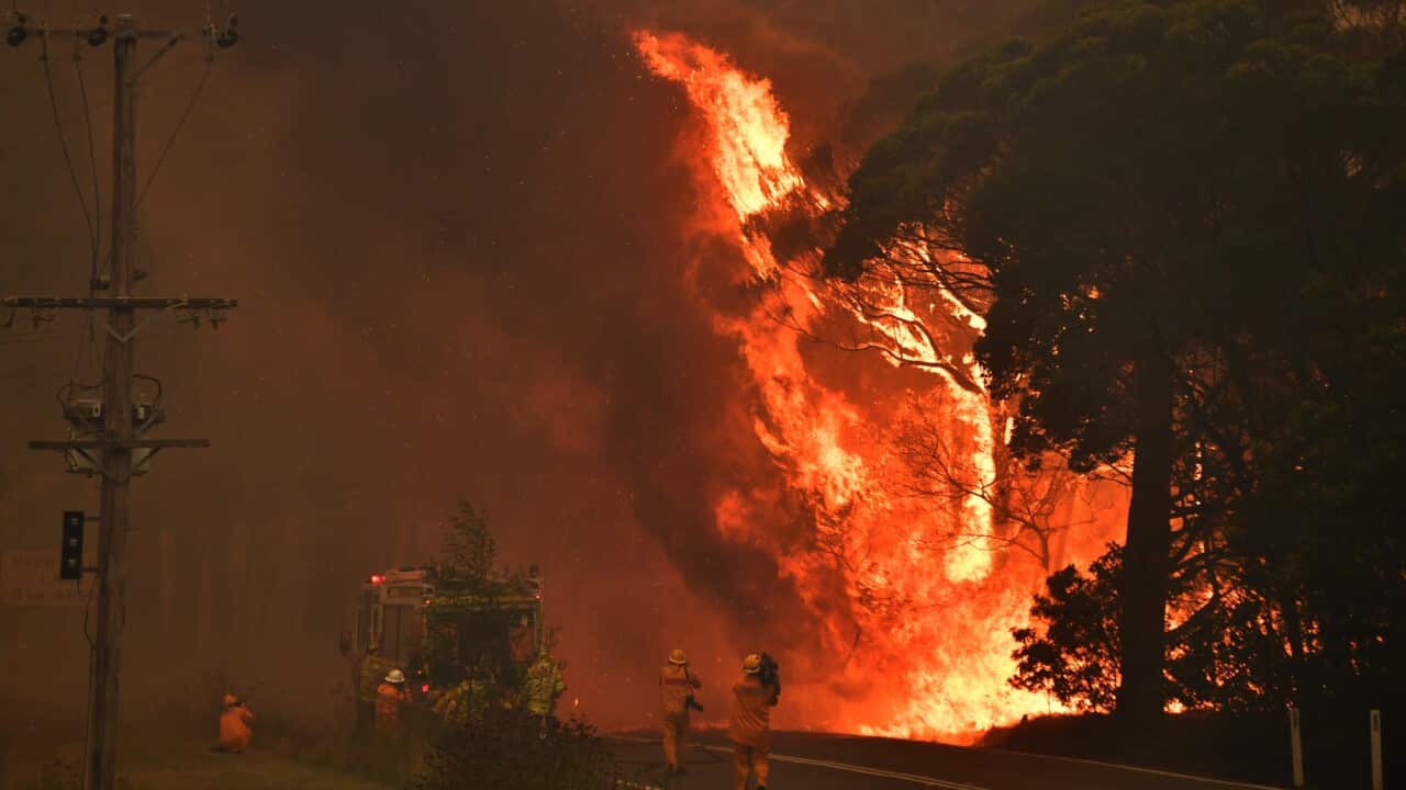 A fire truck is seen during a bushfire near Bilpin, 90km north west of Sydney, Thursday, December 19, 2019. (AAP Image/Mick Tsikas) NO ARCHIVING