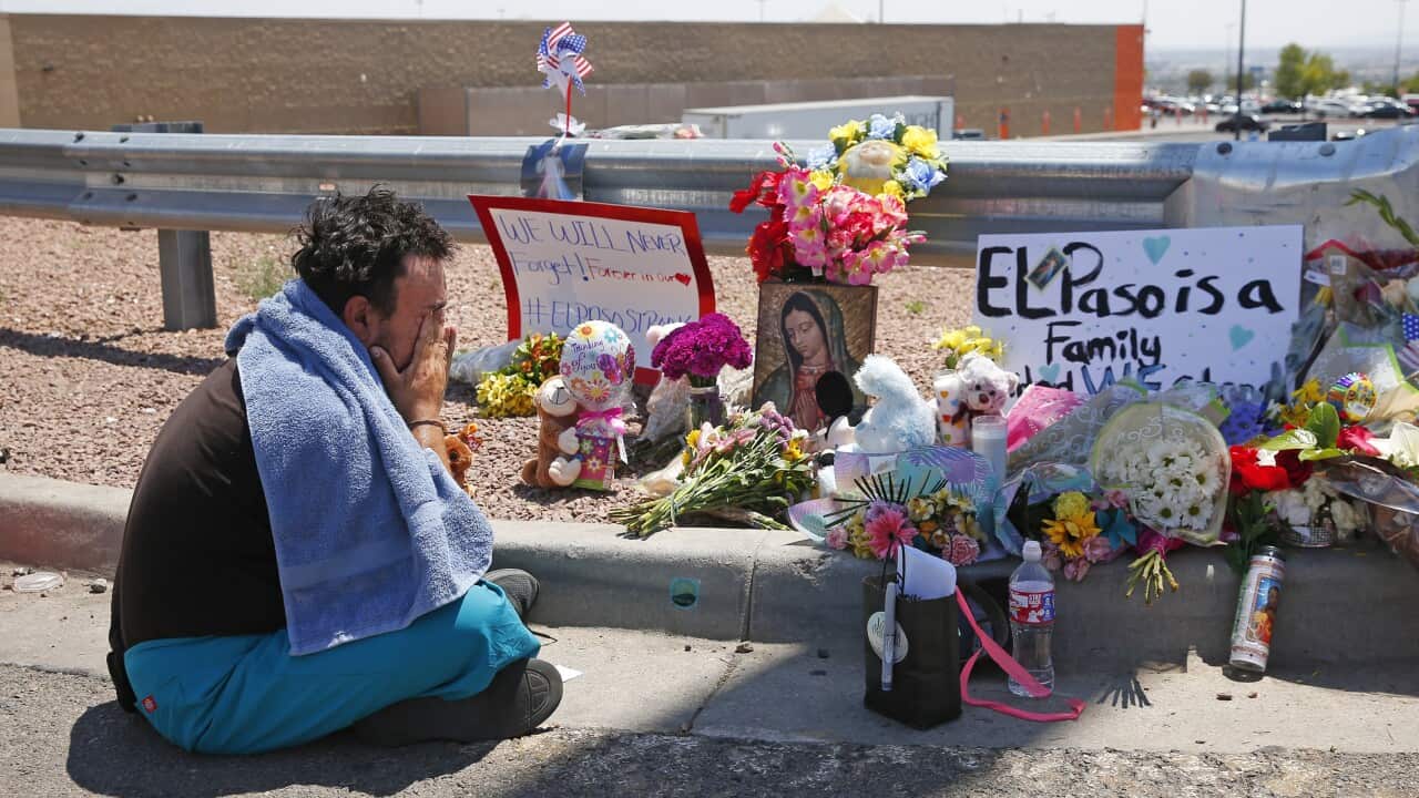 Felipe Avila mourns outside Walmart in El Paso August 4, 2019.