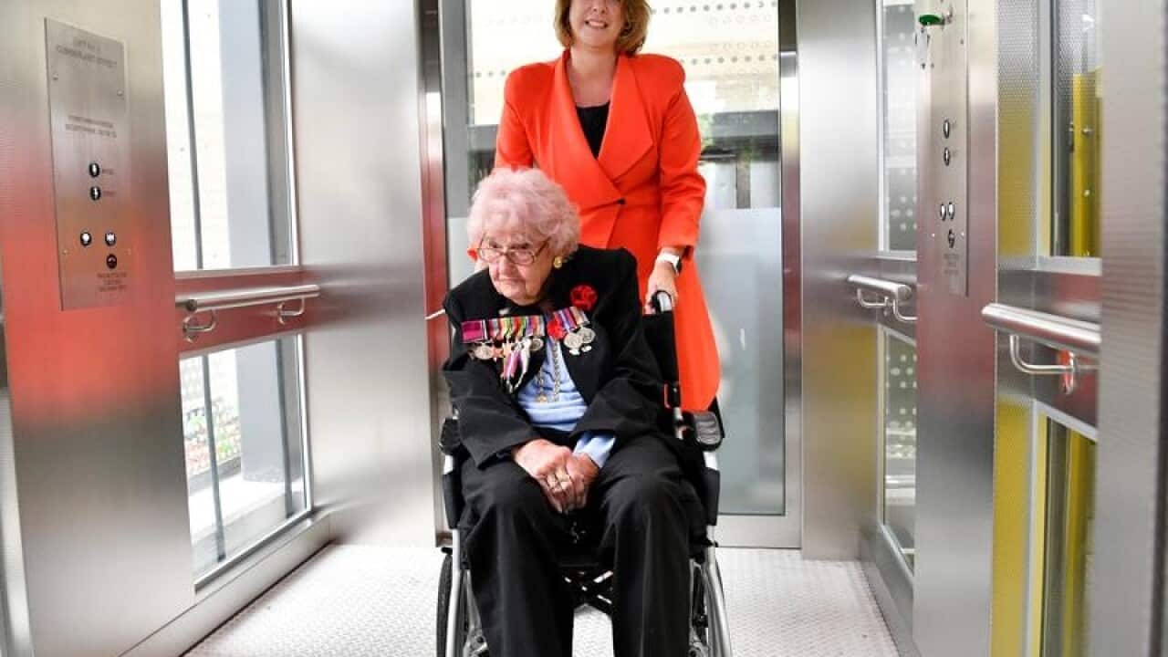 Daphne Dunne is wheeled into a new lift.