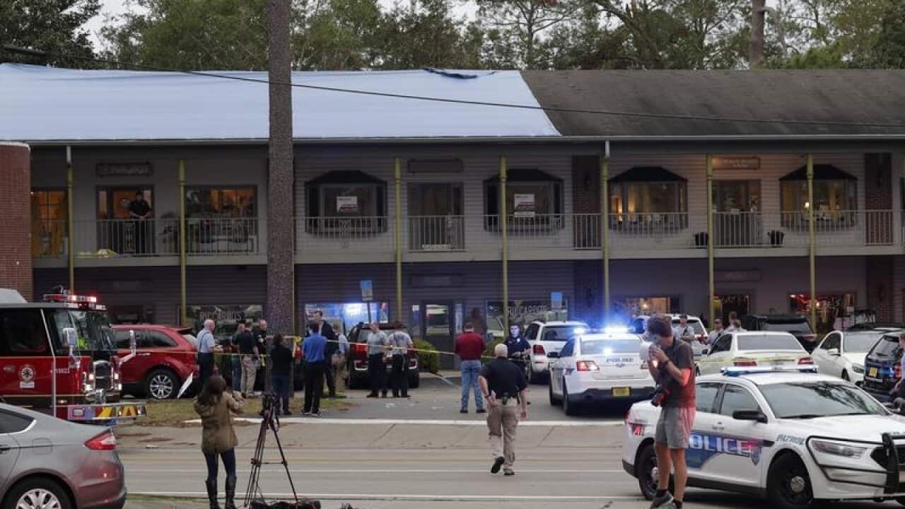 Police investigators at the scene of the shooting