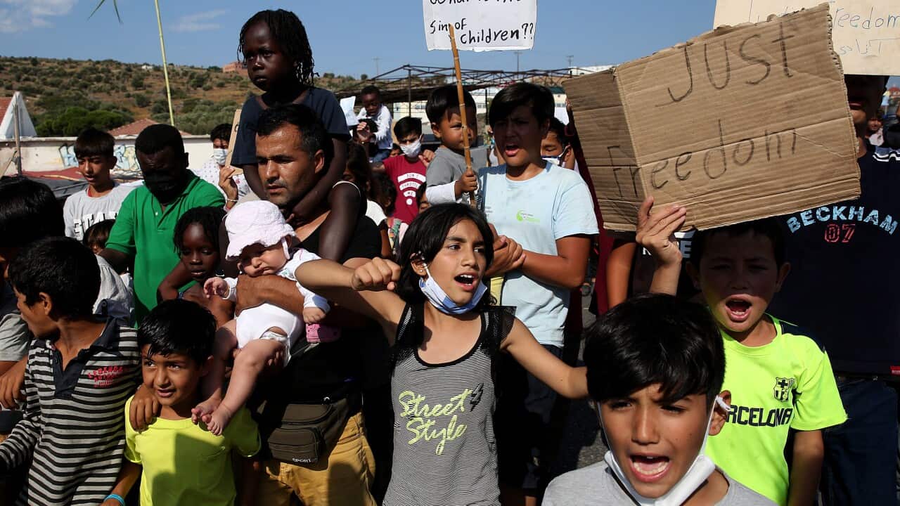 Asylum seekers protest against the new camp at Kara Tepe on Lesbos island, Greece, on 12 September.