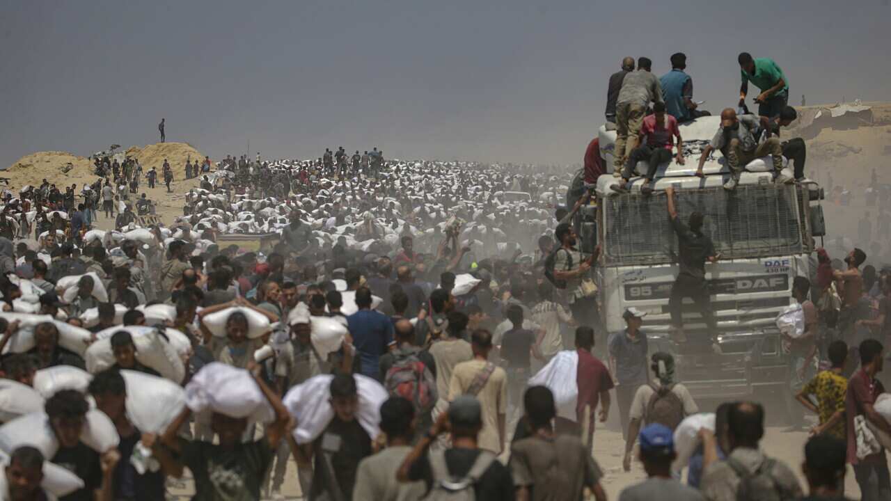 Aid enters Gaza Strip after Israel announces daily pause of hostilities