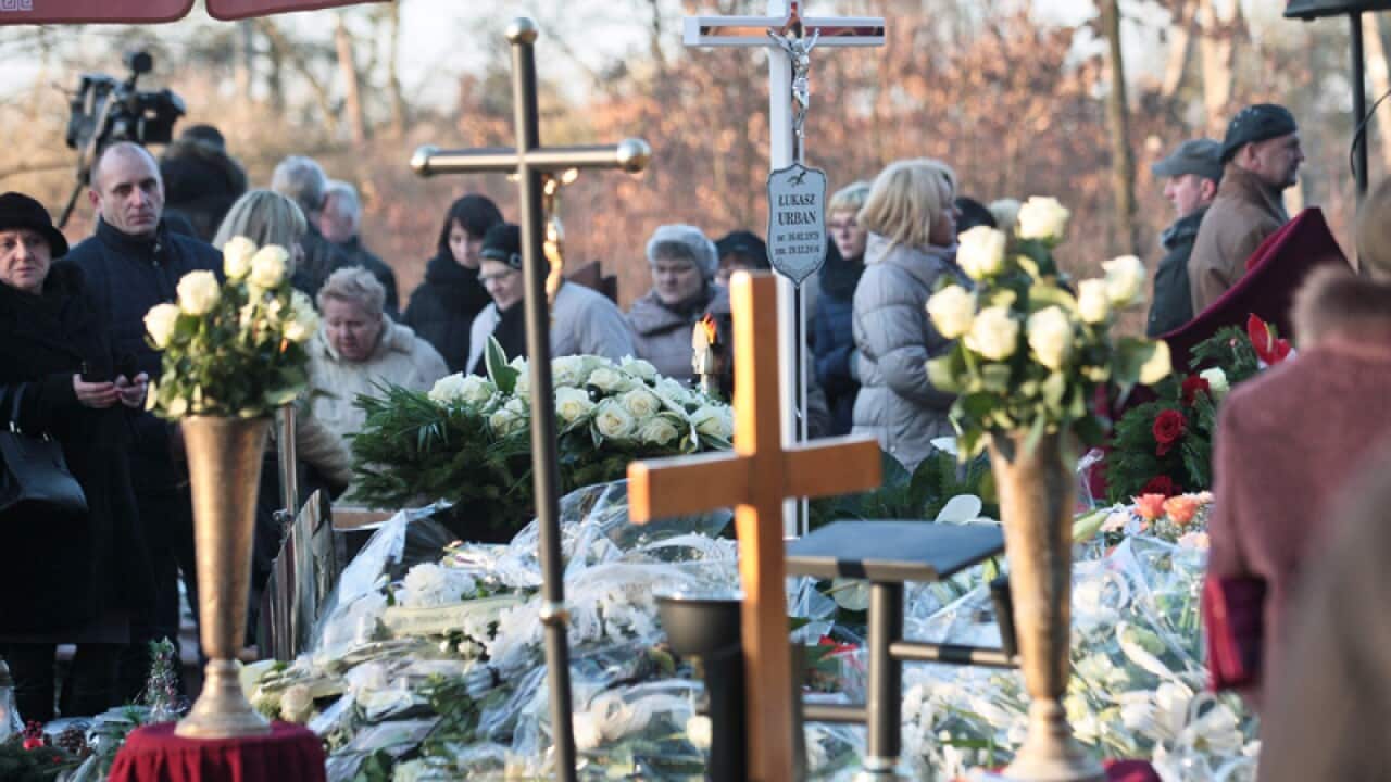 the grave of the Polish truck driver Lukasz Urban