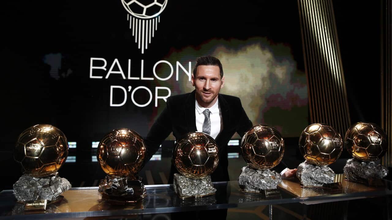 The Men's 2019 Ballon d'Or winner Barcelona forward Lionel Messi poses with his six Ballon d'Or.