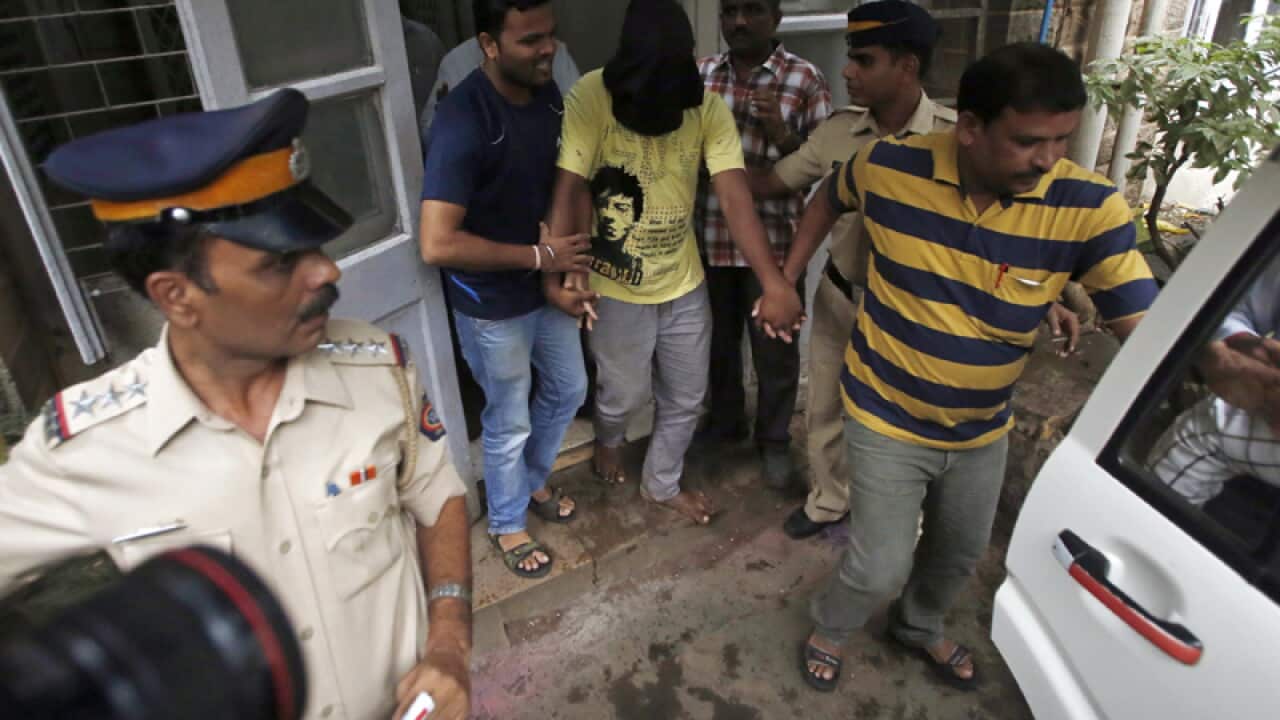 A man (C) accused of the gang rape of a female Indian photographer