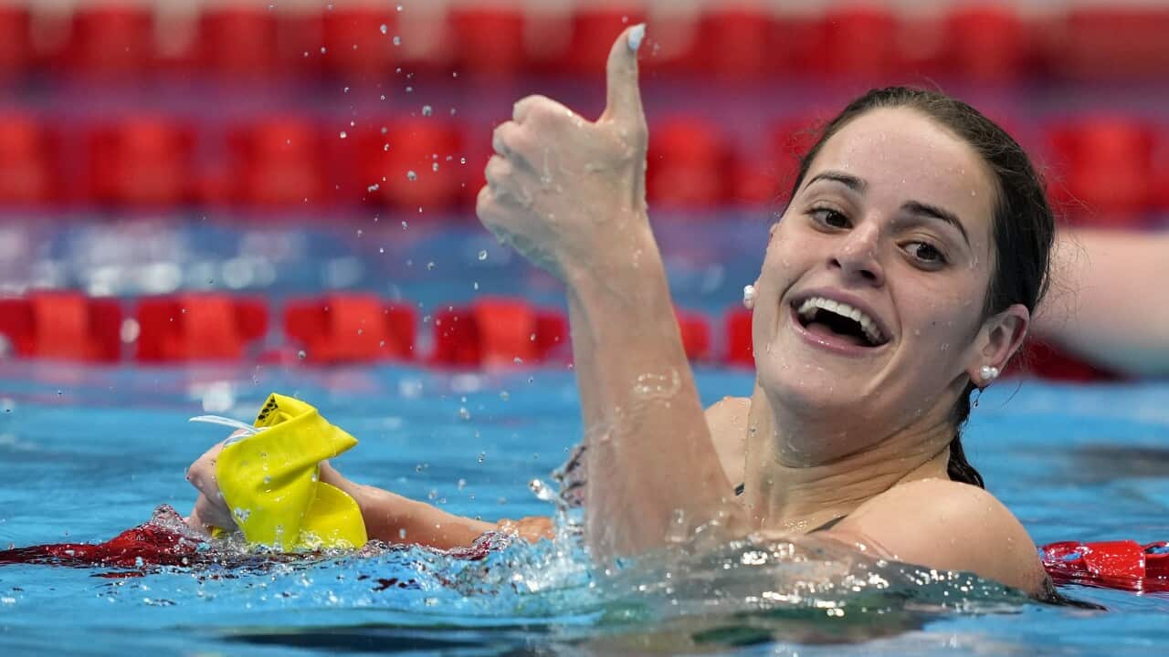 Kaylee McKeown gives a thumbs-up after winning the final of the women's 100-metre backstroke at the Tokyo Olympic Games