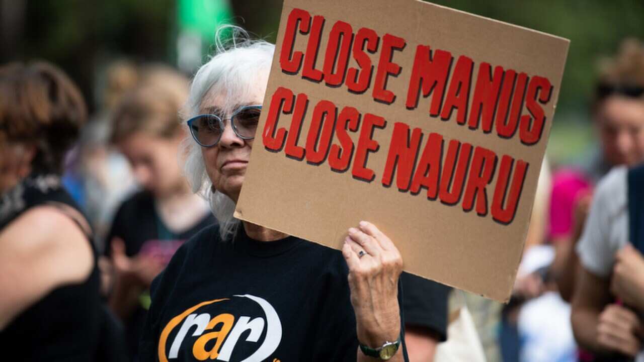 Refugee advocates are seen during Palm Sunday Rally for refugees at Belmore Park in Sydney, Sunday, April 14, 2019. (AAP Image/Paul Braven) NO ARCHIVING