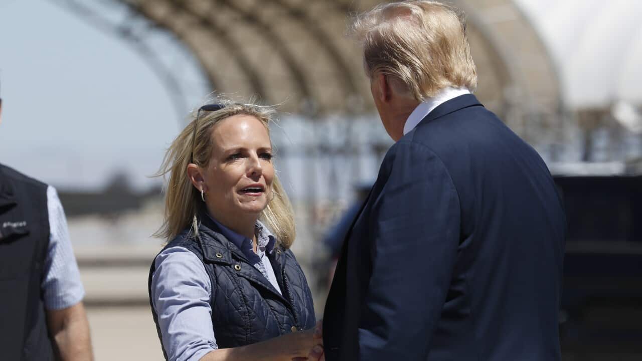 President Donald Trump greets Homeland Security Secretary Kirstjen Nielsen after he arrived on Air Force One at Naval Air Facility El Centro, in El Centro, Calif., Friday April 5, 2019. (AP Photo/Jacquelyn Martin)