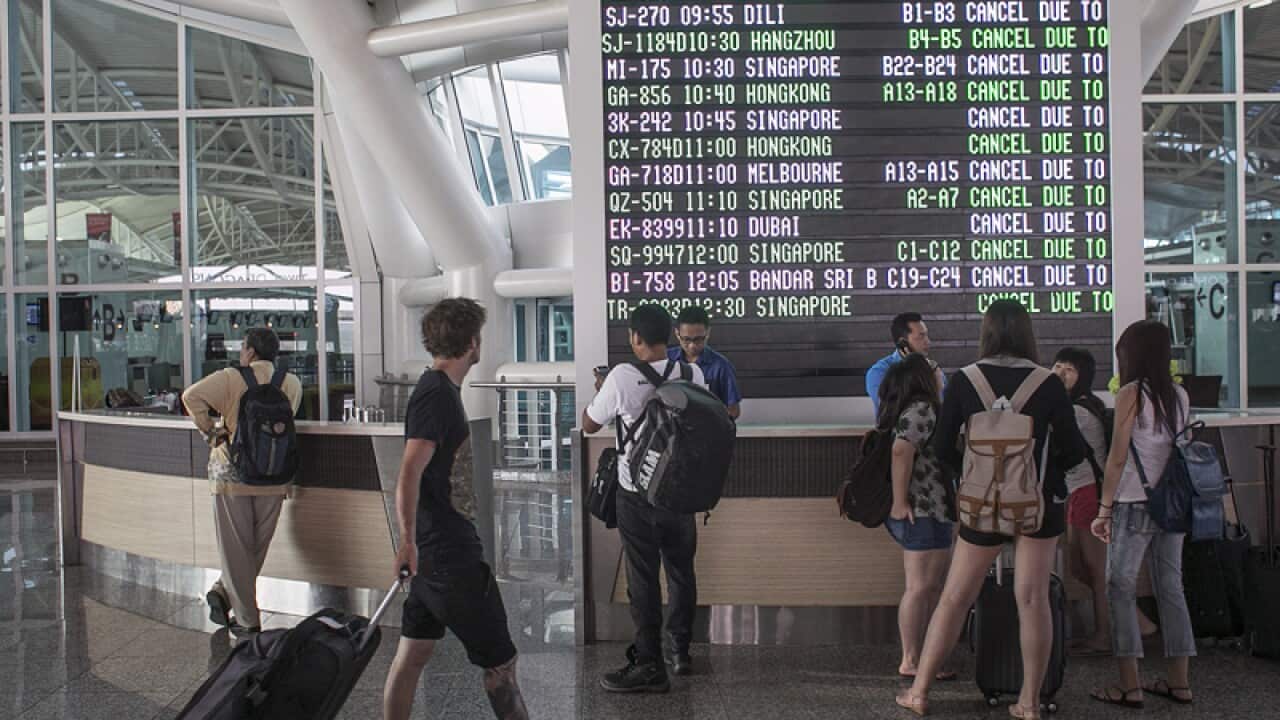 Travellers at Denpasar airport in Bali