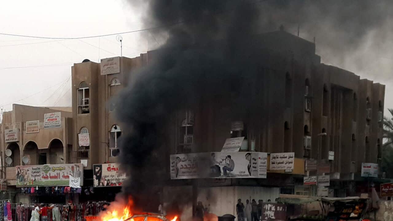 The site of a car bomb in Baghdad