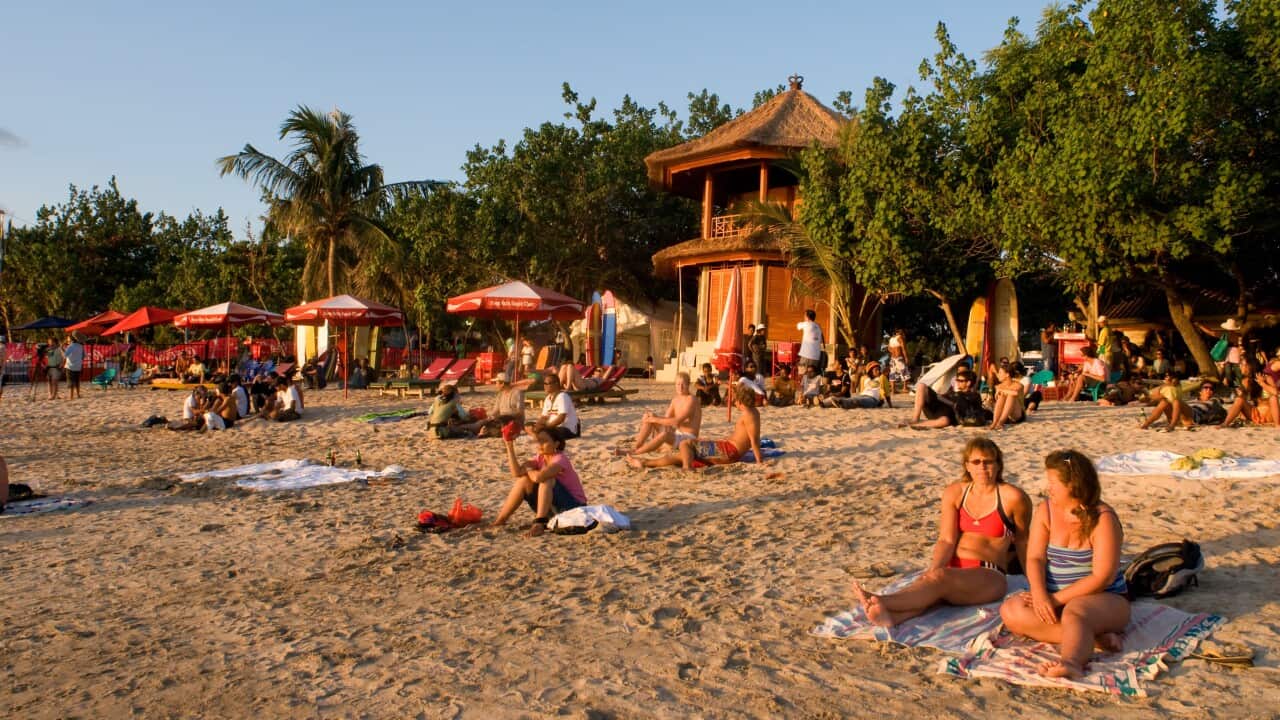 People sitting on a beach.