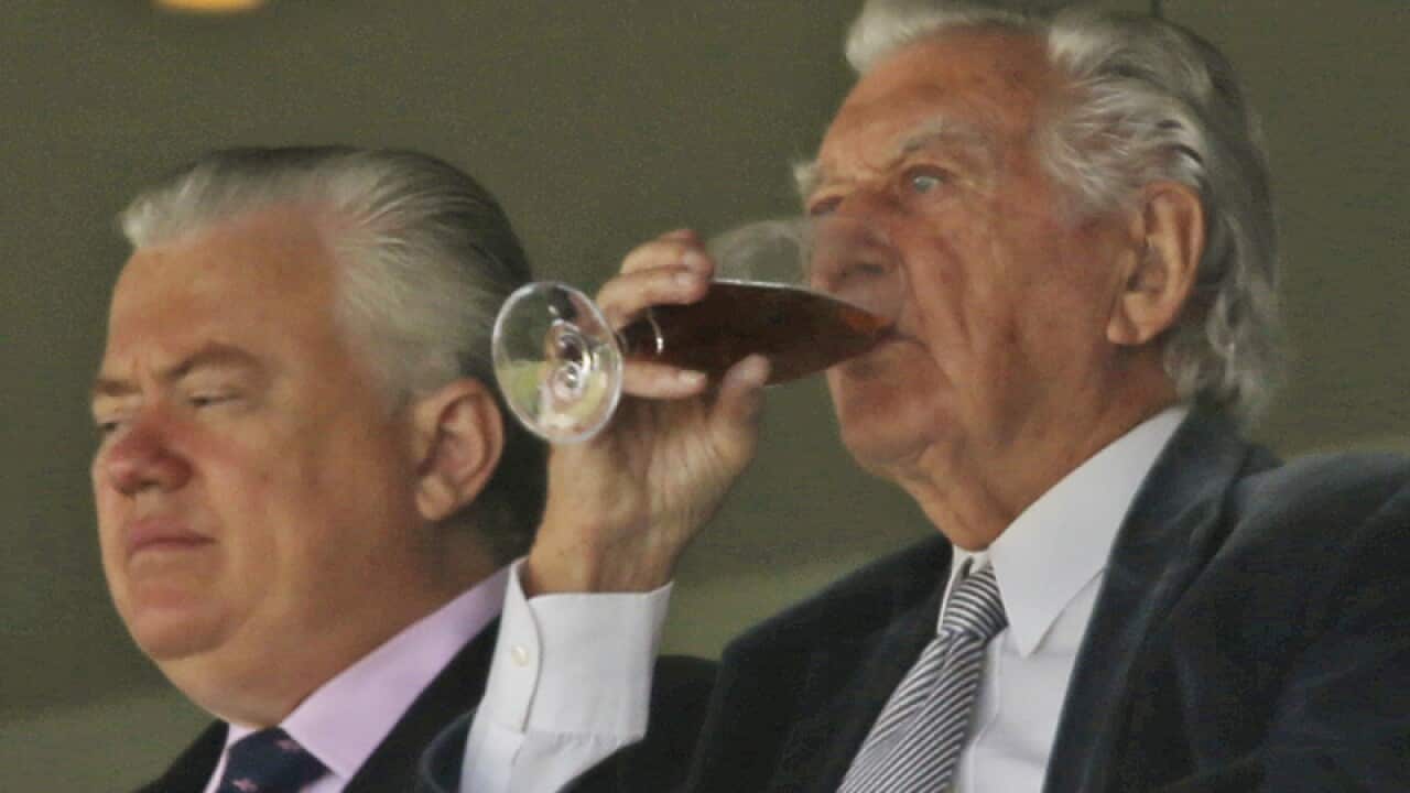 Former Australian prime minster Bob Hawke enjoys a drink