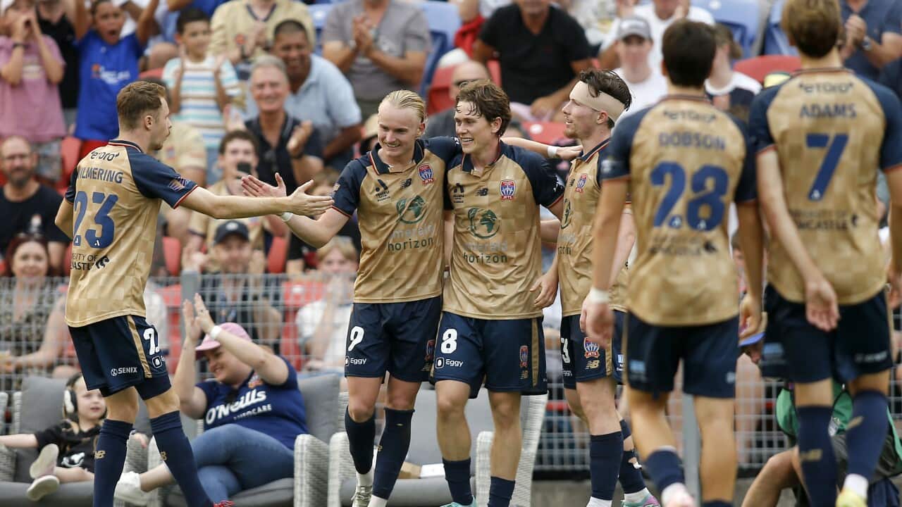 Jets players celebrate a goal to Lachlan Bayliss during the A-League Men Round 15 match between the Newcastle Jets and Brisbane Roar at McDonald Jones Stadium in Newcastle