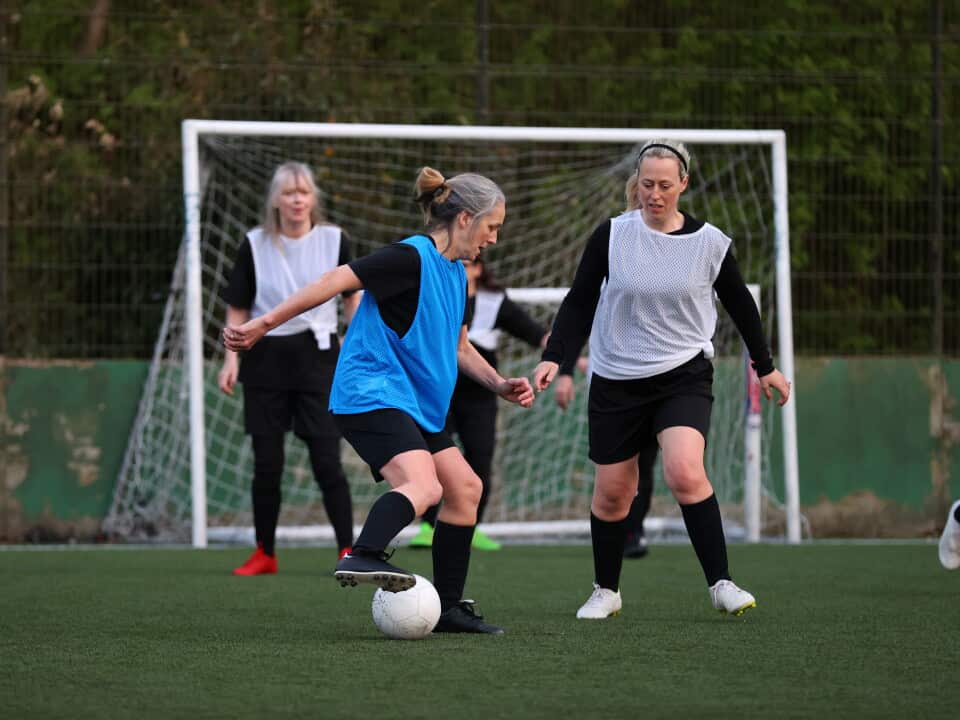 Women compete in a football match