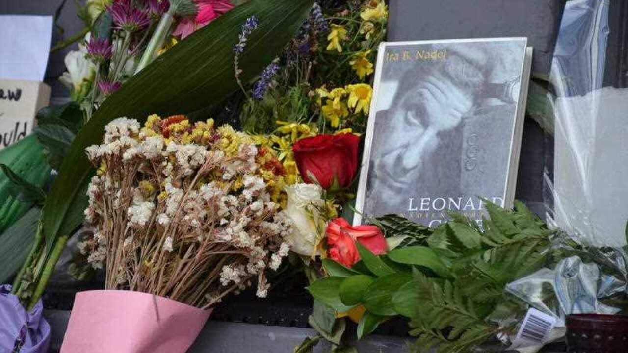 The doorsteps of Leonard Cohen's Montreal, Canada home is decorated with flowers, albums, candles and pictures by his fans