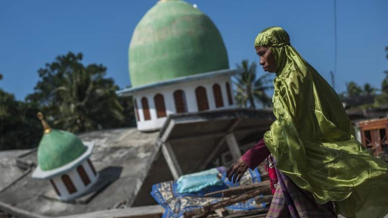 A file image of a collapsed mosque after the early quake