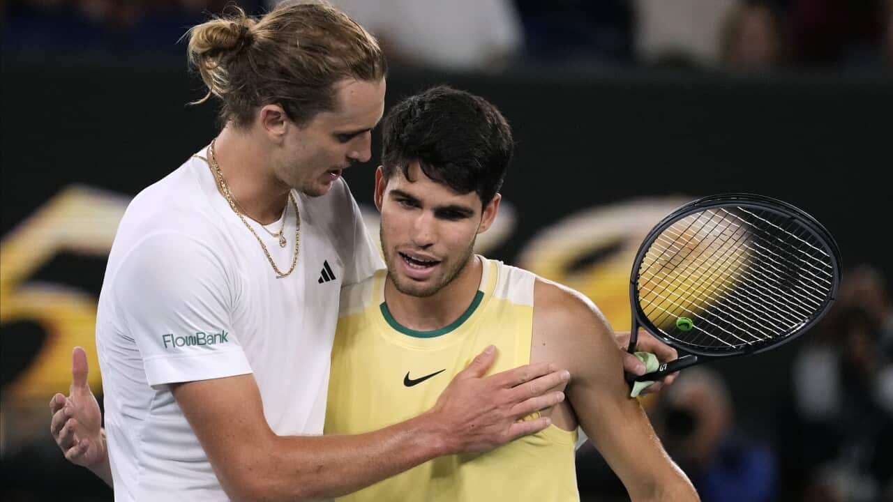 Alexander Zverev, left, is congratulated by Carlos Alcaraz following their quarterfinal match at the Australian Open tennis championships at Melbourne Park