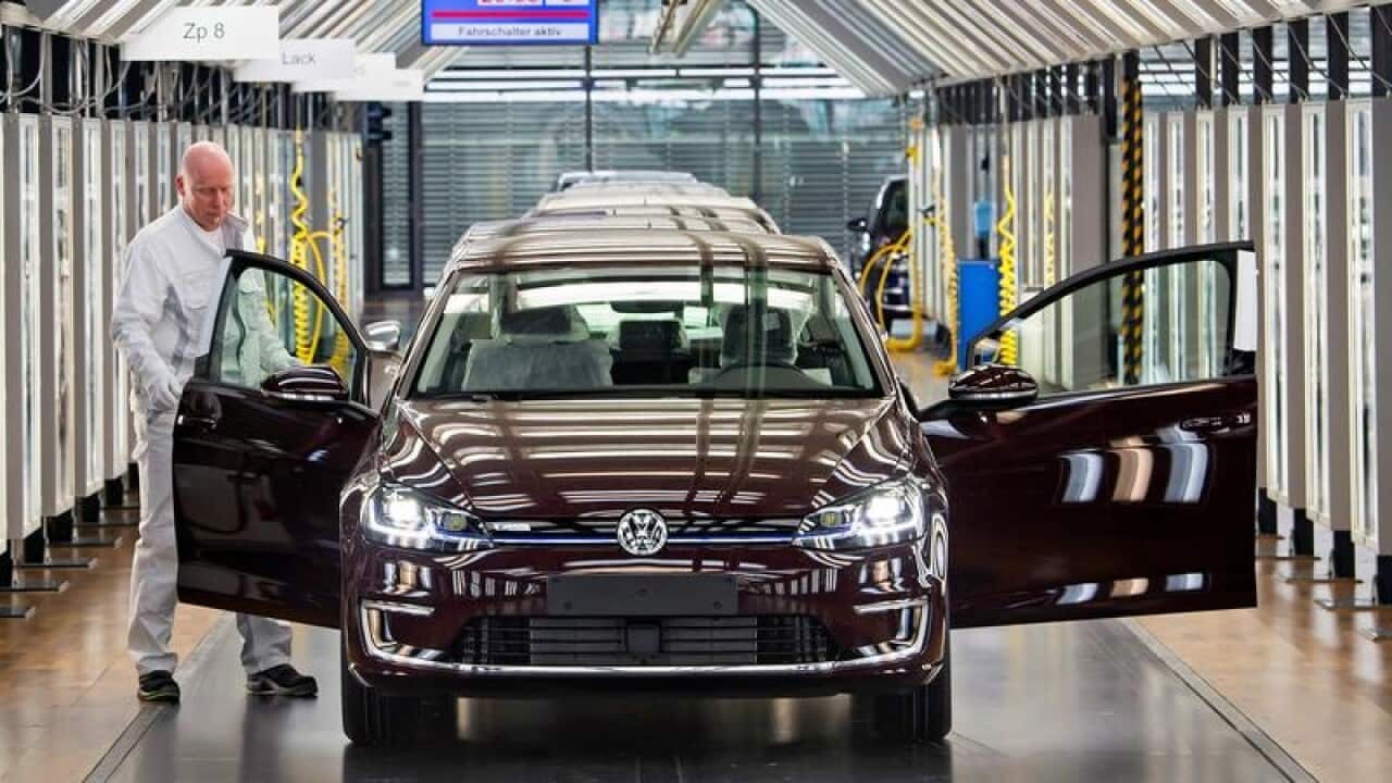 A file image of Roland Schulz and an e-Golf electric car in Germany.