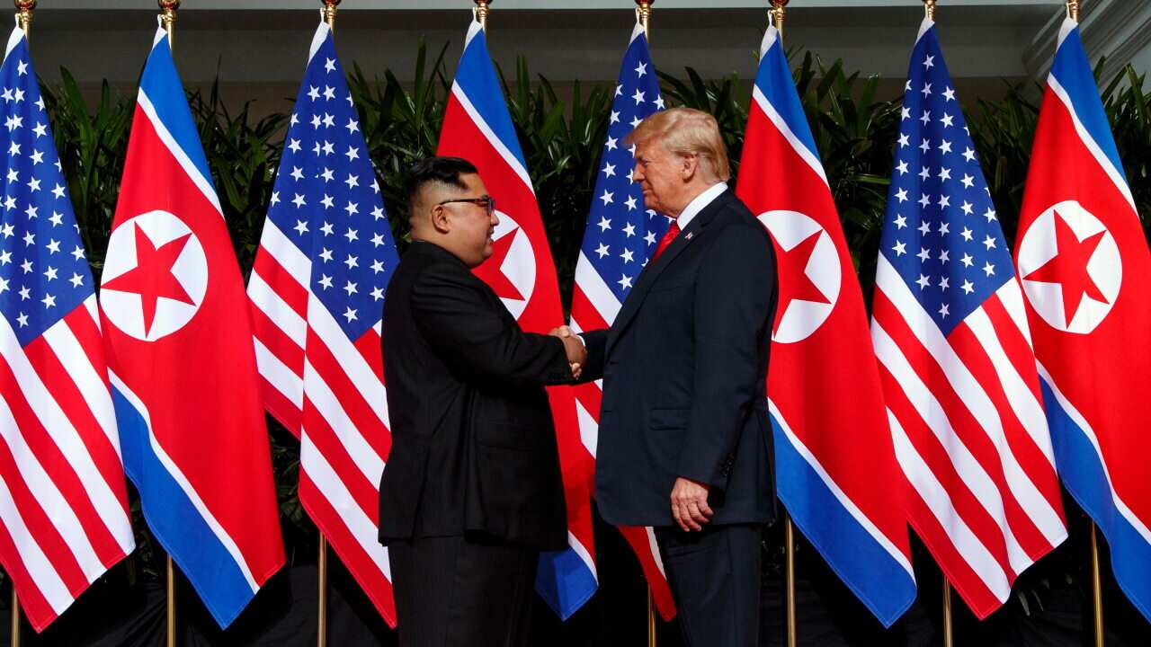 North Korean leader Kim Jong Un and U.S. President Donald Trump shake hands prior to their meeting on Sentosa Island in Singapore, June 12, 2018.