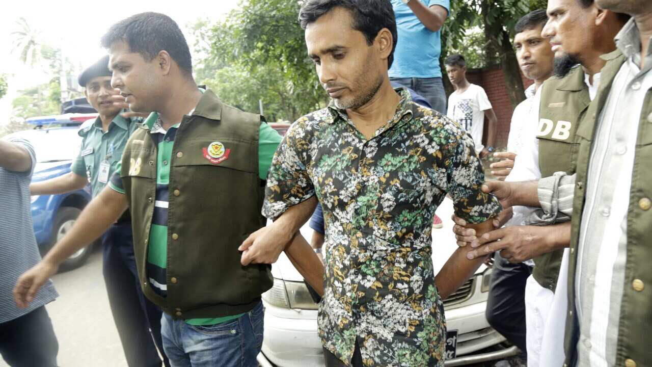 Bangladesh detective police (DB) escort Shariful Islam (C) as they have claimed to have arrested him in connection with the murder of LGBT rights activists