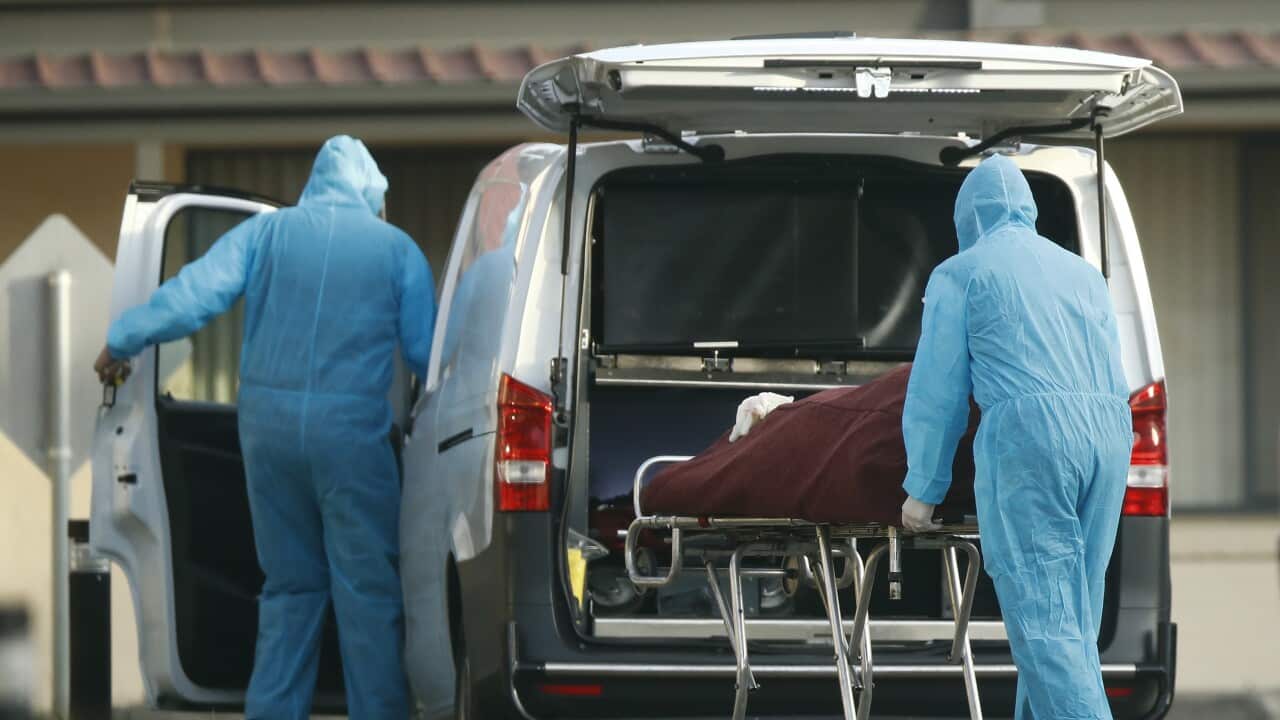 A body is removed from St Basil’s Homes for the Aged in Fawkner, Melbourne, Friday, July 31, 2020. (AAP Image/Daniel Pockett) NO ARCHIVING