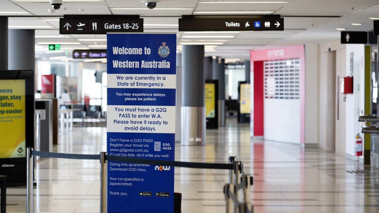 A sign about needing a G2G pass is seen at Perth Domestic airport.