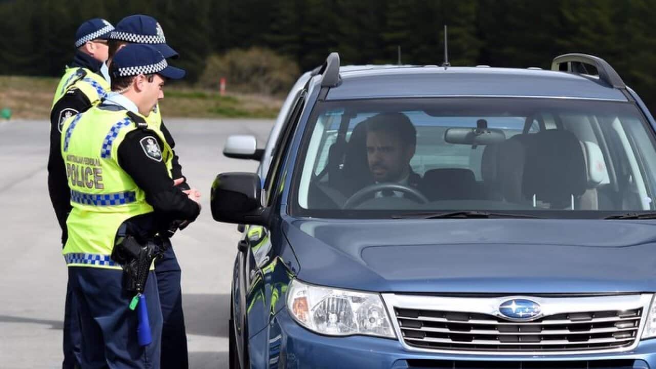 A random breath test is done at the AFP Training Facility in Canberra, Monday, Aug. 17, 2015. (AAP Image/Lukas Coch) NO ARCHIVING