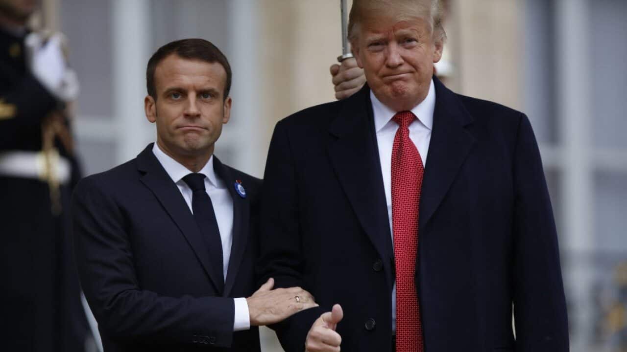 French President Emmanuel Macron welcomes U.S. President Donald Trump prior to their meeting at the Elysee Presidential Palace on November 10, 2018 in Paris, France (AAP)