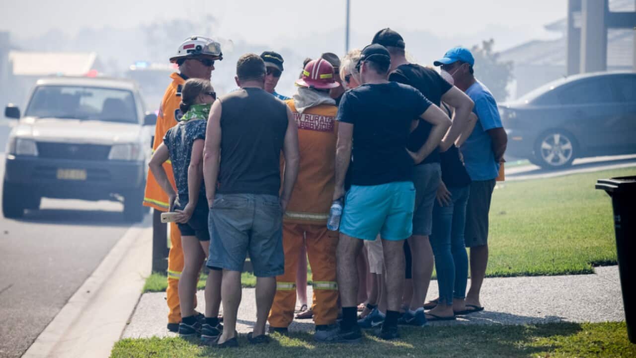 Residents seek advice and information from NSW RFS fire fighter Ken Middleton(centre) in Gandangara Estate Barden Ridge, Sydney, Monday, April, 2018