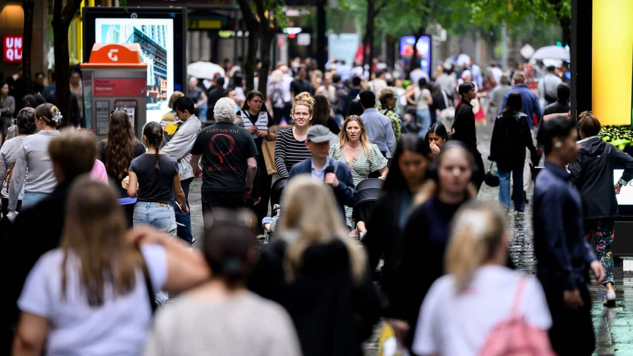 Shoppers wander the street.