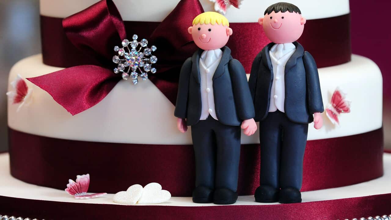 General view of groom cake decorations on a wedding cake
