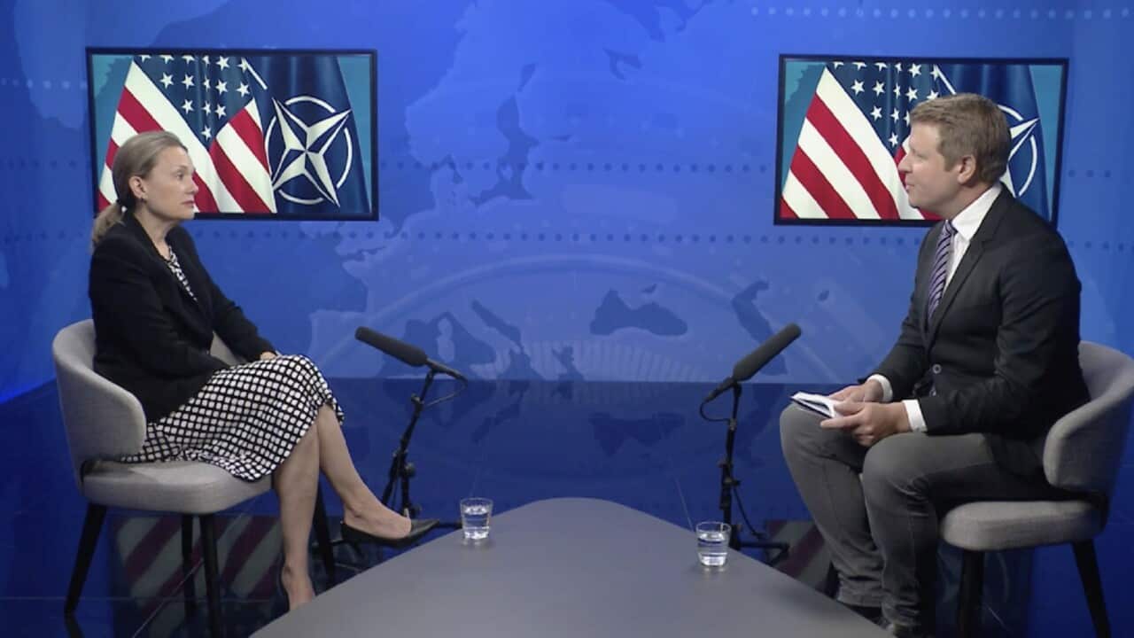 US Ambassador to NATO Julianne Smith with Chief International Correspondent Ben Lewis (SBS).jpg