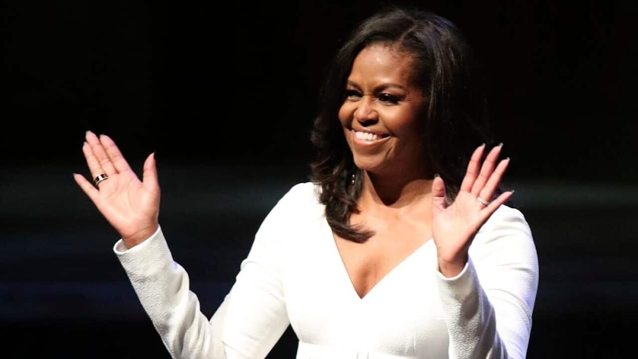 Michelle Obama acknowledges the crowd during her visit to the UK to publicize her memoir Becoming, at the Royal Festival Hall in London, Monday, Dec. 3, 2018. (Yui Mok/PA via AP)