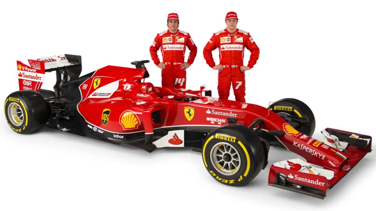Fernando Alonso, left, and Kimi Raikkonen near the new Ferrari F14 T