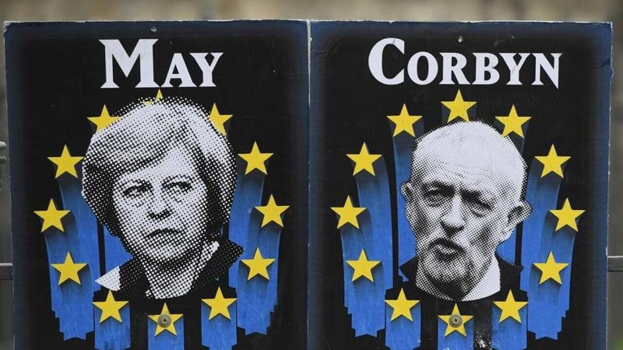 Posters mocking Theresa May and Jeremy Corbyn in Westminster