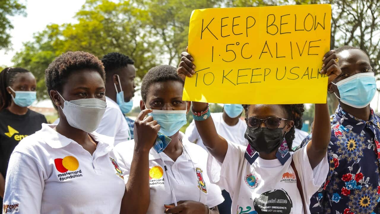 Climate activist holds a placard during a Fridays for Future protest in Nakuru.