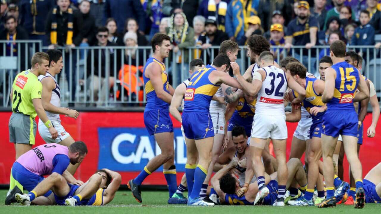 Scuffles break out after a tackle on the Eagles' Andrew Gaff (L) during the match between the West Coast Eagles and the Fremantle Dockers in Perth