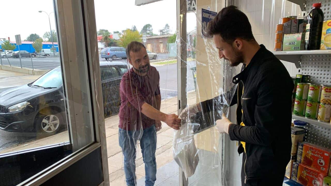 Arkan Shahwan Azawy serving customer