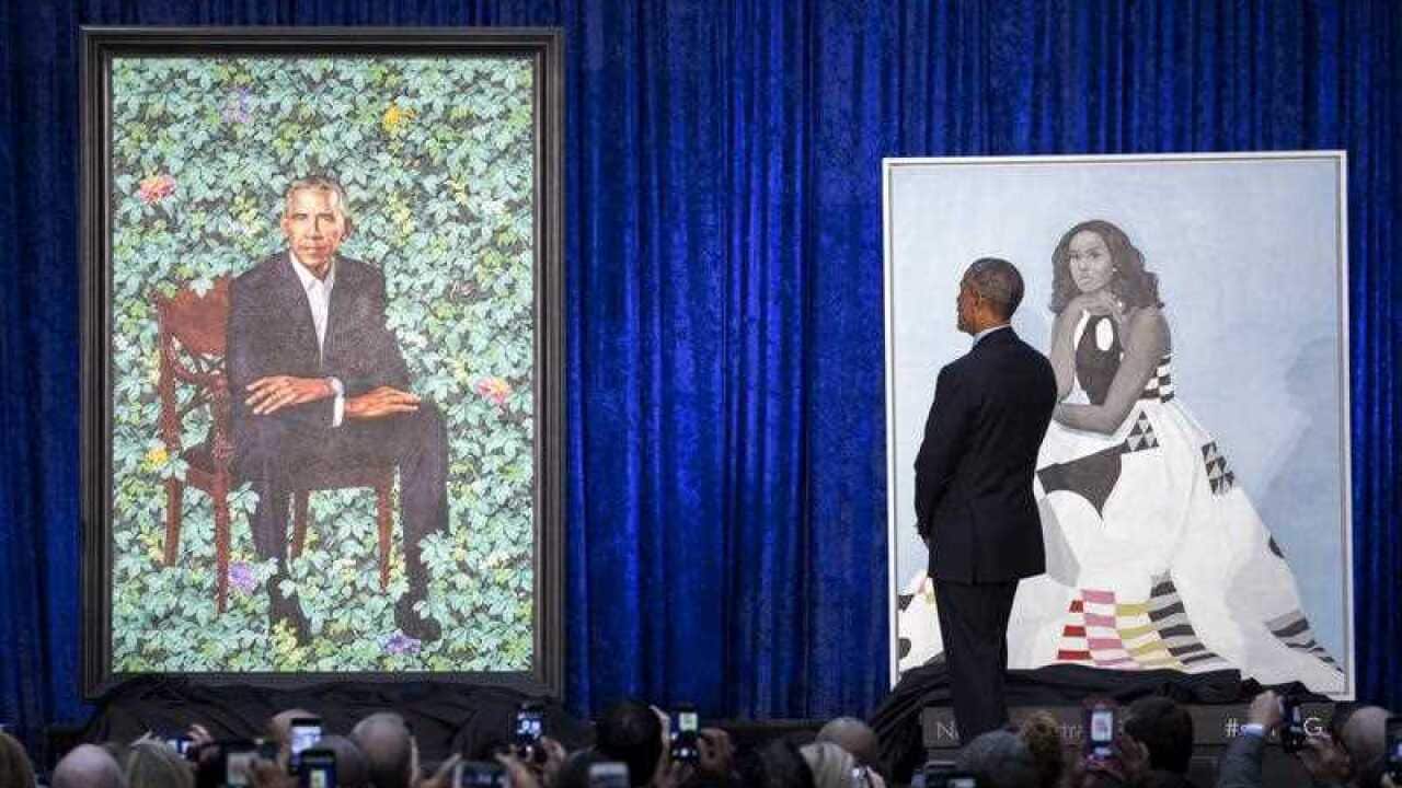Former US President Barack Obama participates in the unveiling of his official portrait at the Smithsonian's National Portrait Gallery.