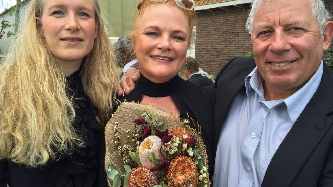 Wilma van Duyn, centre, with husband Jack and cousin Mirjam, at Vijfhuizenclutch banksias and other flowers that they will lay at a new memorial near Amsterdam for those lost in the MH17 disaster